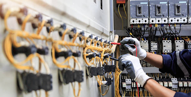 Professional Electrician technician working in Tropical Park, FL